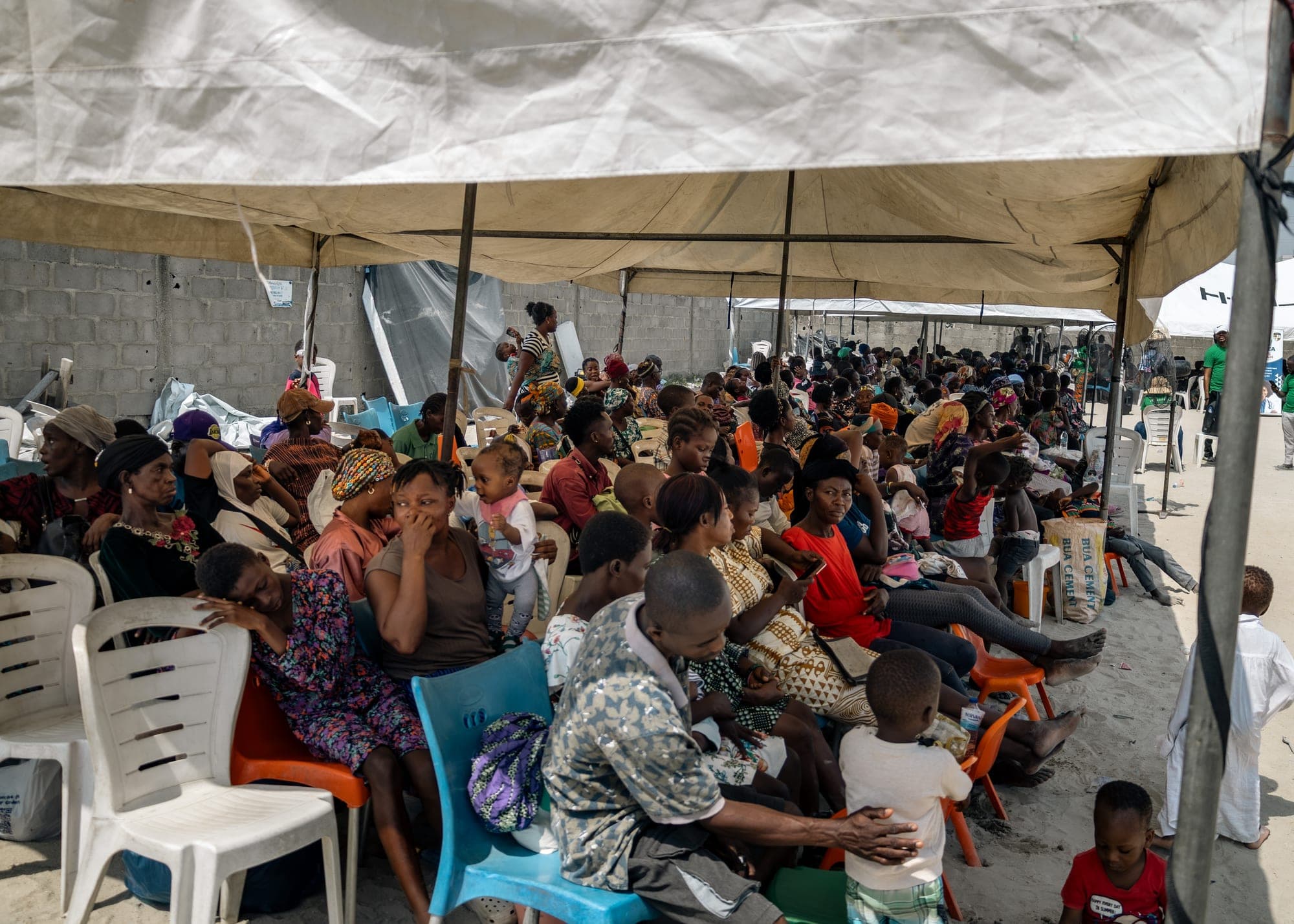 People seated in rows under canopies waiting to be seen at the Ilasan medical outreach in Lekki, Lagos.